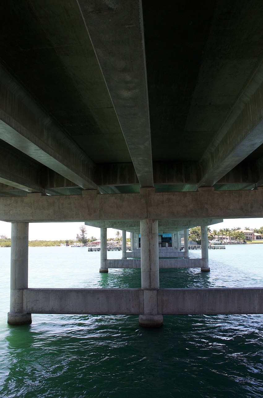 A walkway under the New Pass Bridge leads from parking at Overlook Park to the nature preserve.
