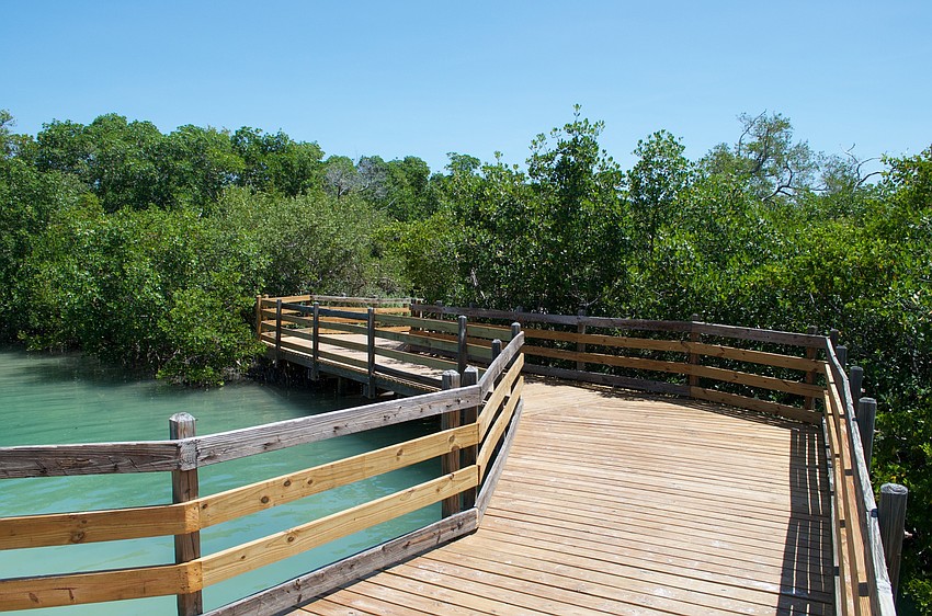 Boardwalks connect sandy trails over the nature preserve's lagoons.
