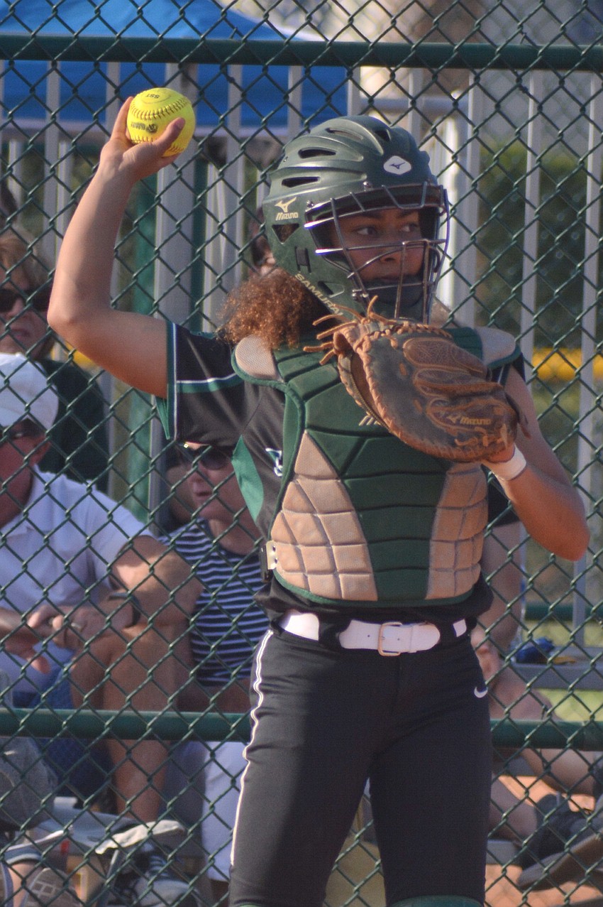 McKenzie Clark tosses a ball back to Brooklyn Lucero. Clark would get the team's only hit of the game, a triple, in the seventh inning.
