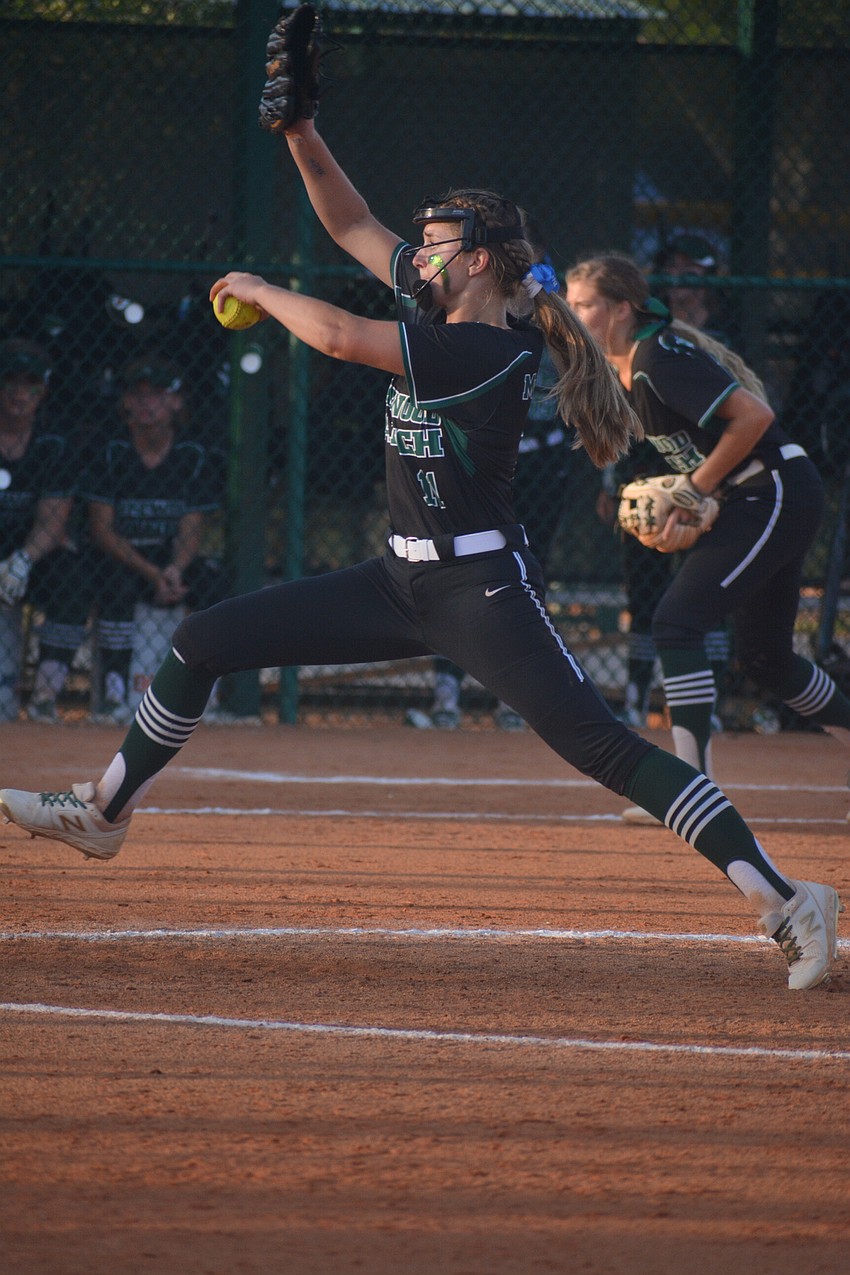 Junior pitcher Claire Davidson rocks and fires to the plate. She pitched the last two innings, allowing zero runs.