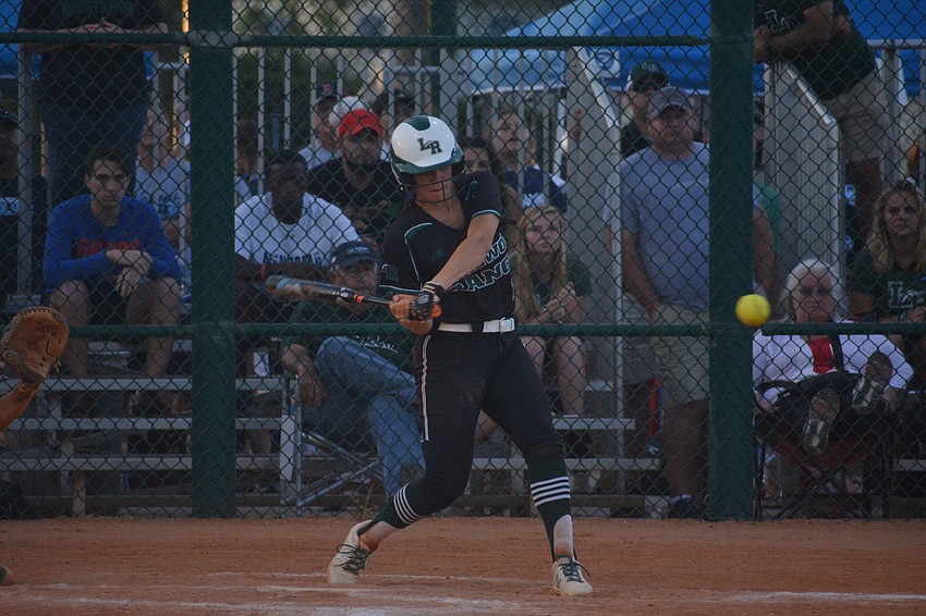 Senior third baseman Maddie Koczersut takes a cut at the plate.
