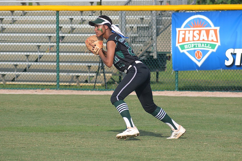 Freshman outfielder Sydney McCray throws a ball to the infield.