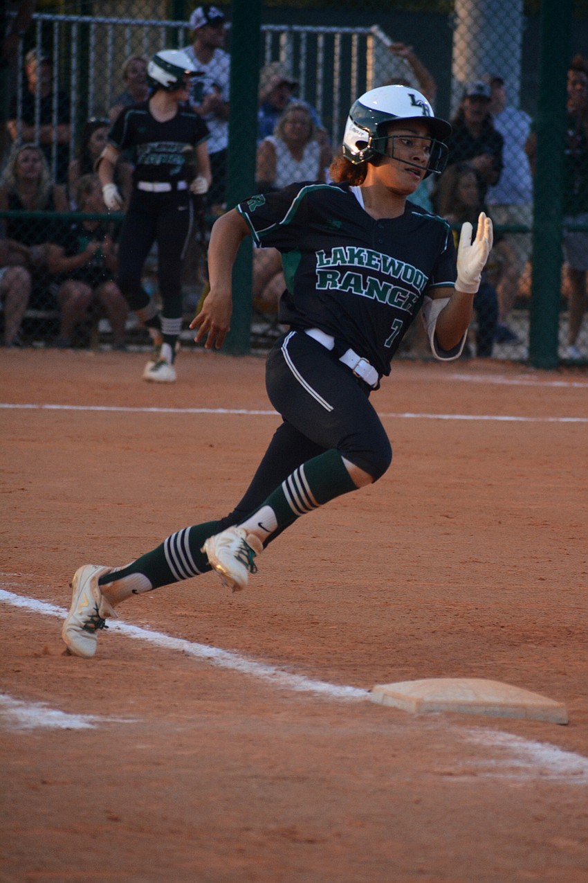 Lakewood Ranch junior catcher McKenzie Clark hustles through first base on what would end up a triple, the only Mustangs hit of the game.