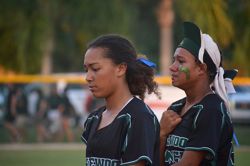 Junior catcher McKenzie Clark and freshman center fielder Sydney McCray leave the field after the loss.