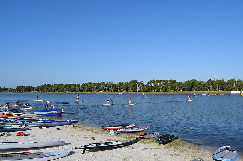 After finishing their run, the work wasn't over. Racers then hopped on a paddle board and got going.
