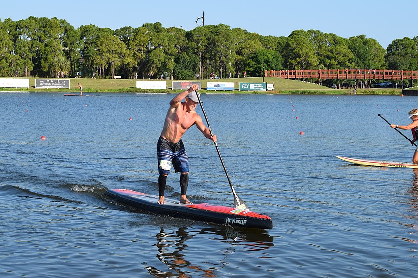 Bruce Day, of Siesta Key, paddled his boat back to the shore before finally finishing the long race.