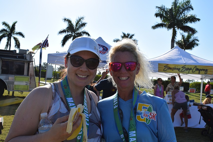 Natalie von Suskil, of Sarasota, and Jackie Trecartin, of Venice, each enjoyed a banana after their race to replenish their energy.