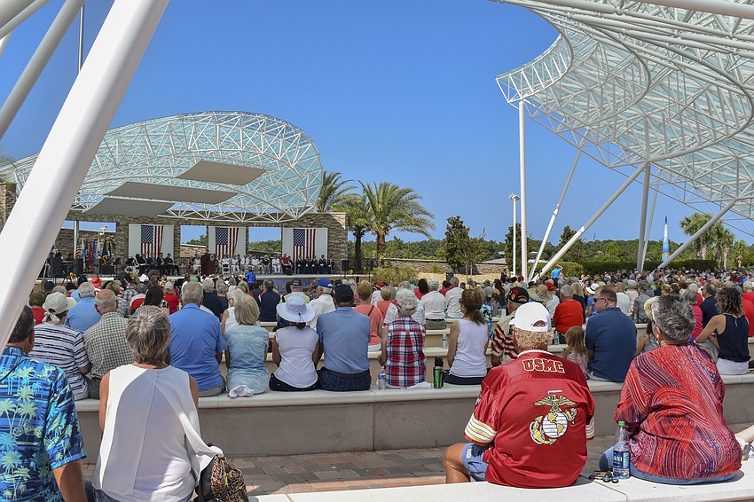 People in the audience dress in red, white and blue to celebrate Memorial Day.