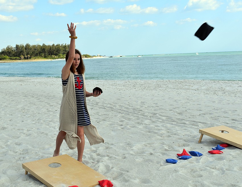 Molly Dillon takes a shot during a game of corn hole.