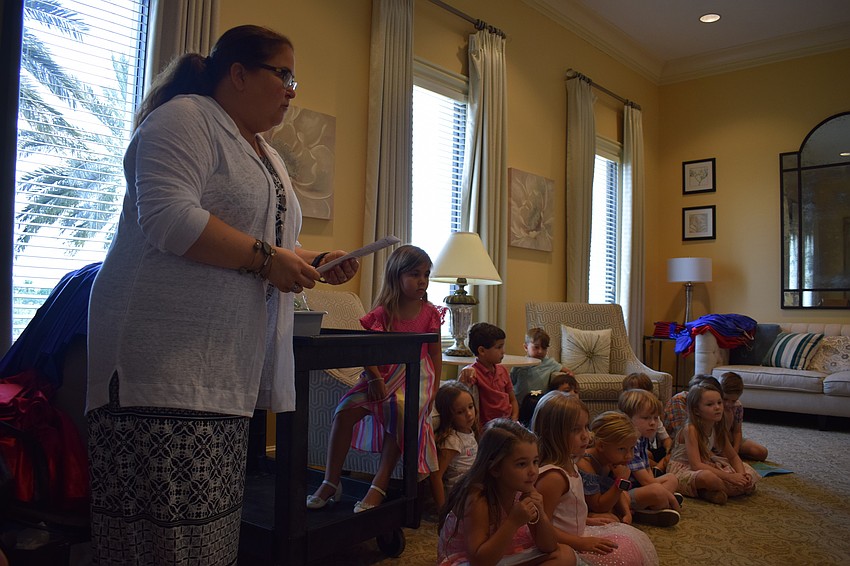 Karin Kiernan prepares students for their graduation.