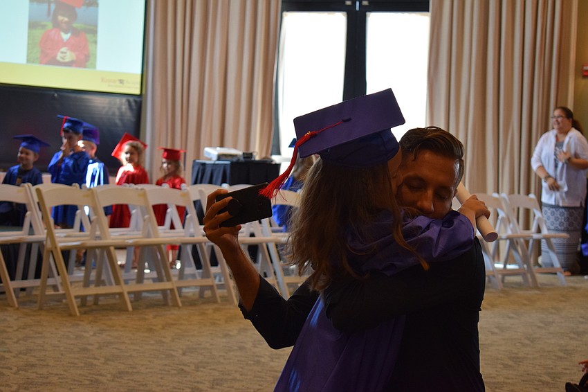 Bayshore's Jorge Carvalho hugged his daughter, Mia.