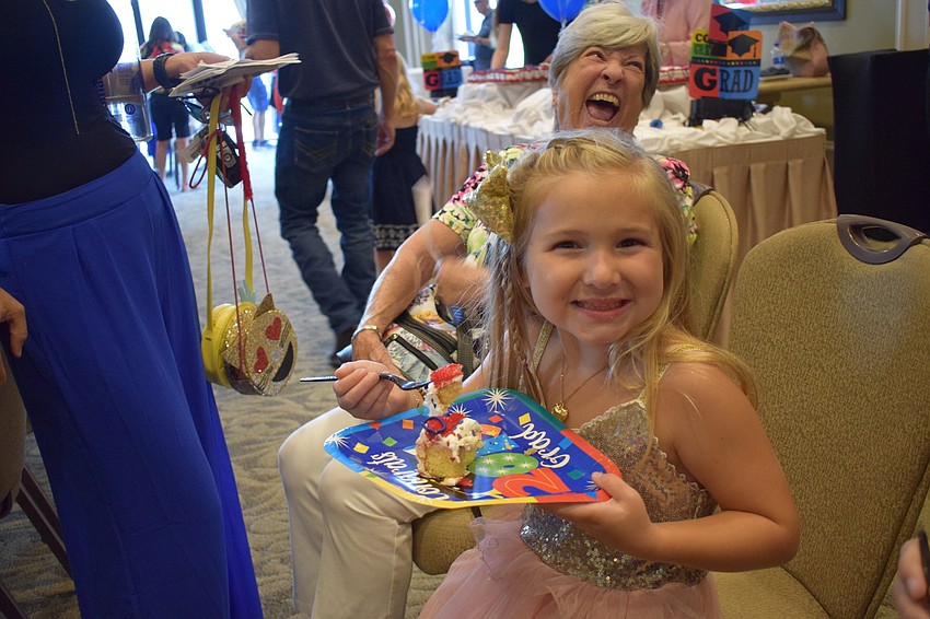 Savannah's Madisyn Bailey enjoyed cake in celebration of her achievement.