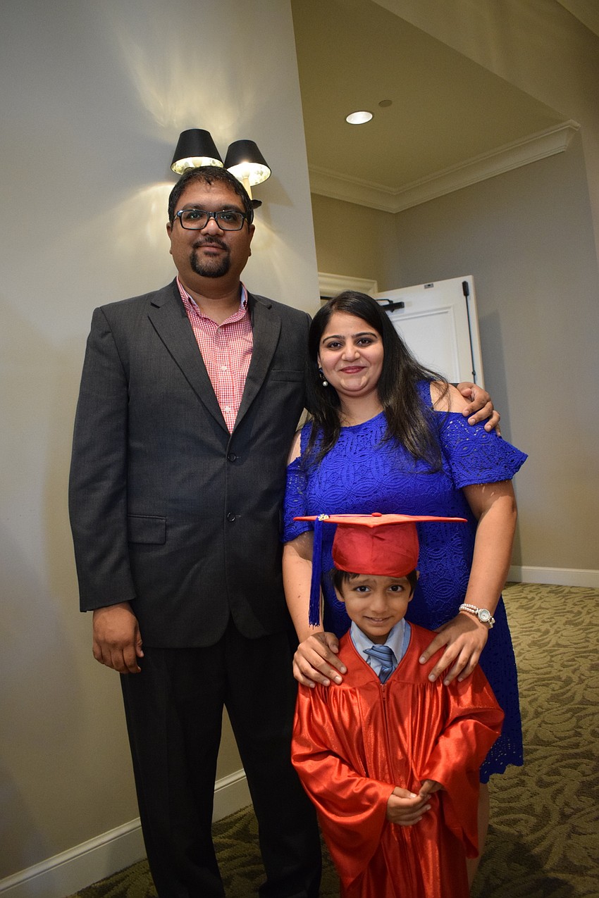 Miromar's Aayansh Dhamsania take a moment with his parents, Gaurav and Mansi Dhamsania.