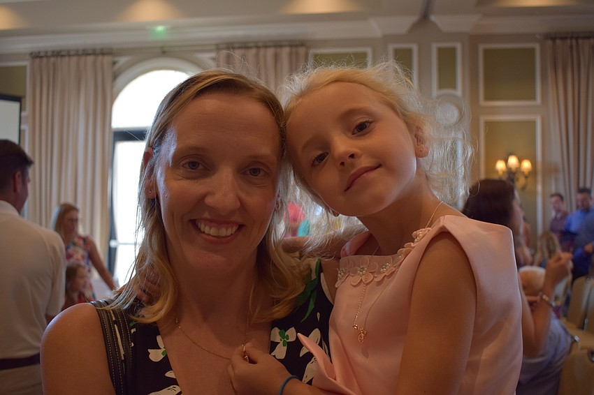 Lakewood Ranch's Heather Curry holds her daughter, Emma, who is on her way to kindergarten after graduating from preschool.