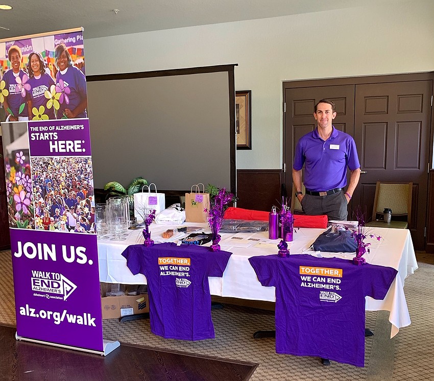 Ryan Smith, from the Florida Gulf Coast Chapter of the Alzheimer's Association, sold merchandise at the event. Photo courtesy Bryan Veith.
