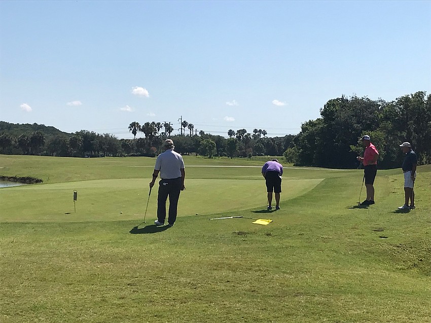 Action from the ninth hole at Heritage Harbor Golf Club and Eatery. Photo courtesy Bryan Veith.