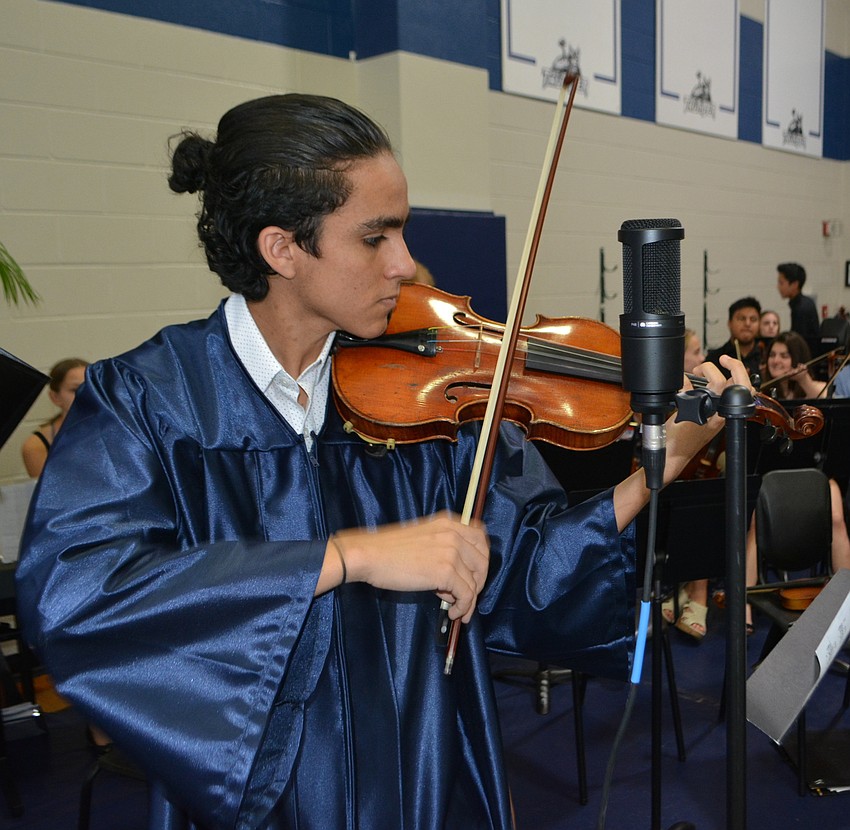 Chris Ramos, who is headed to New York University, entertained the packed venue with a violin solo.