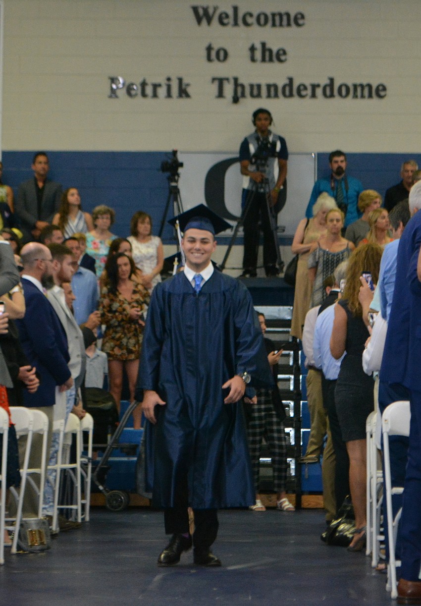 With the first name alphabetically, Zachary Aberle led his class in the senior processional.