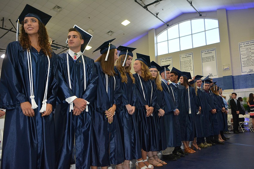 The 81 seniors took their seats.
