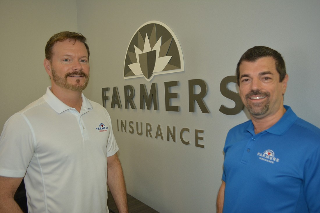 Larry Hansen and Gregory Marholin love their Hansen Agency is so involved with the community.