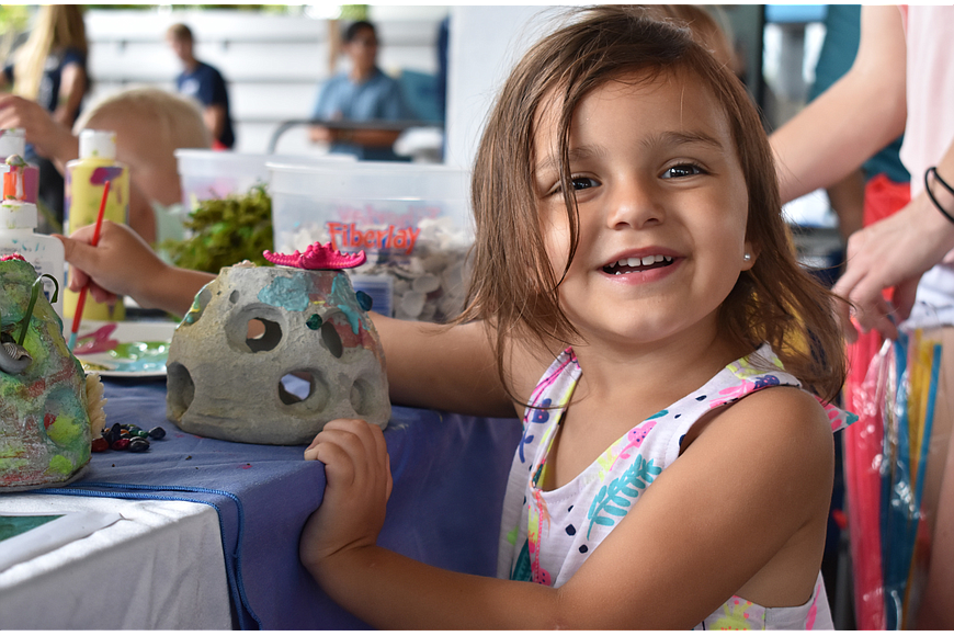 Kierra Hutson paints a ceramic aquarium decoration at World Oceans Day on June 3, 2017, at Mote Aquarium. File Photo