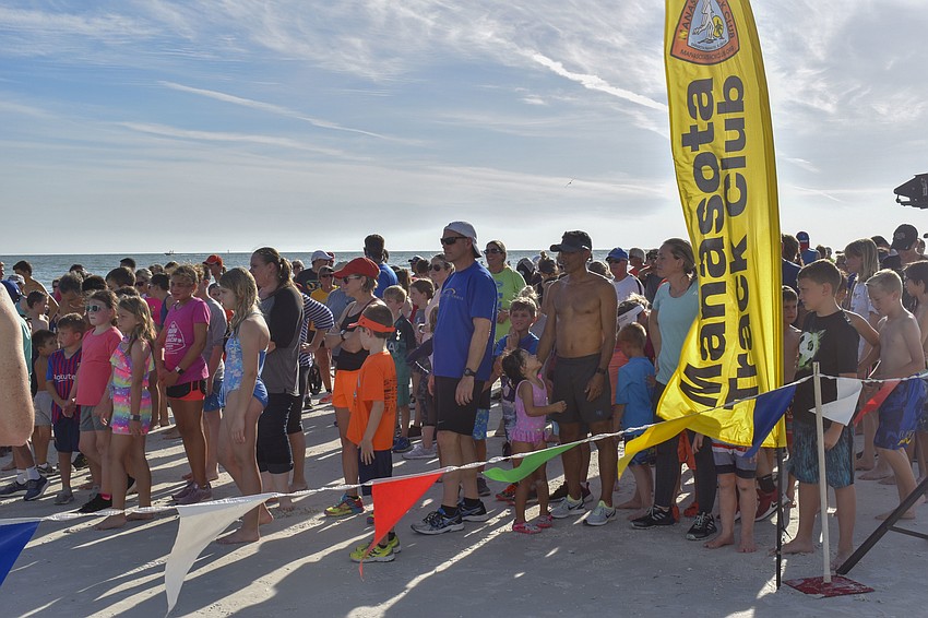 Parents and children wait for the 1-mile run to begin.