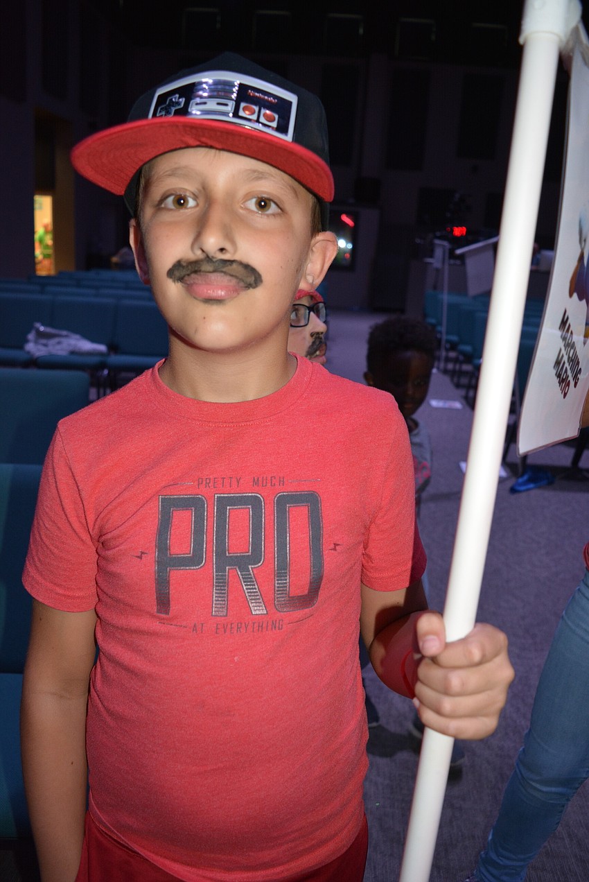 Nine-year-old Dallas Casto says he looks good in his Mario-inspired mustache.