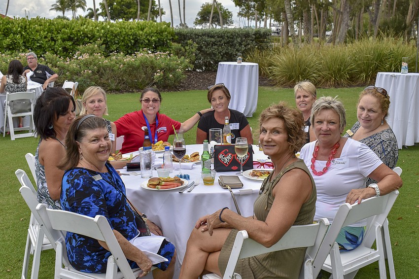 Members of the tri-chambers mingle over dinner.