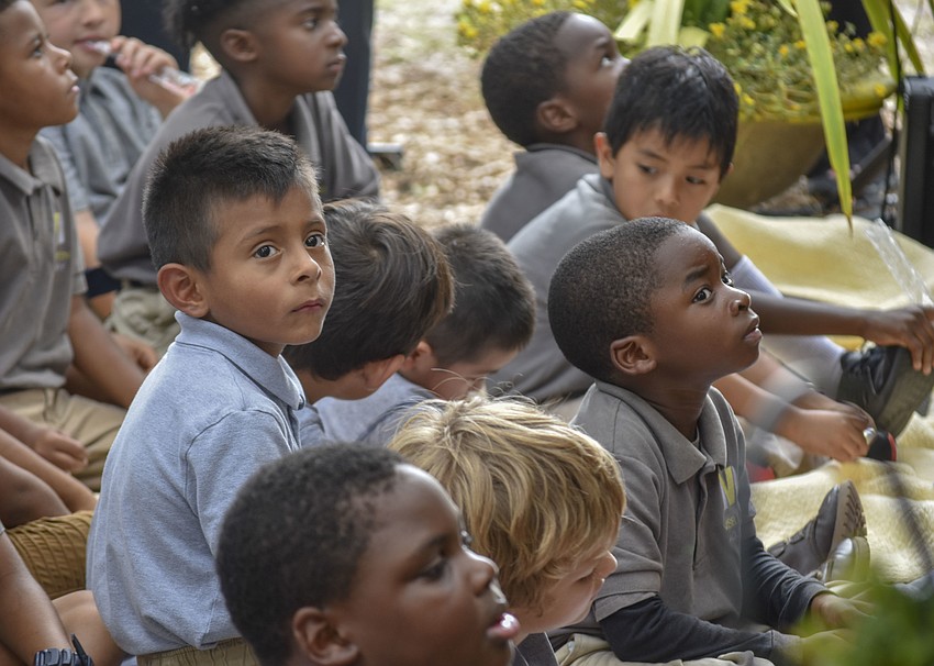 Kindergartners watch as the fourth and fifth grade students perform 
