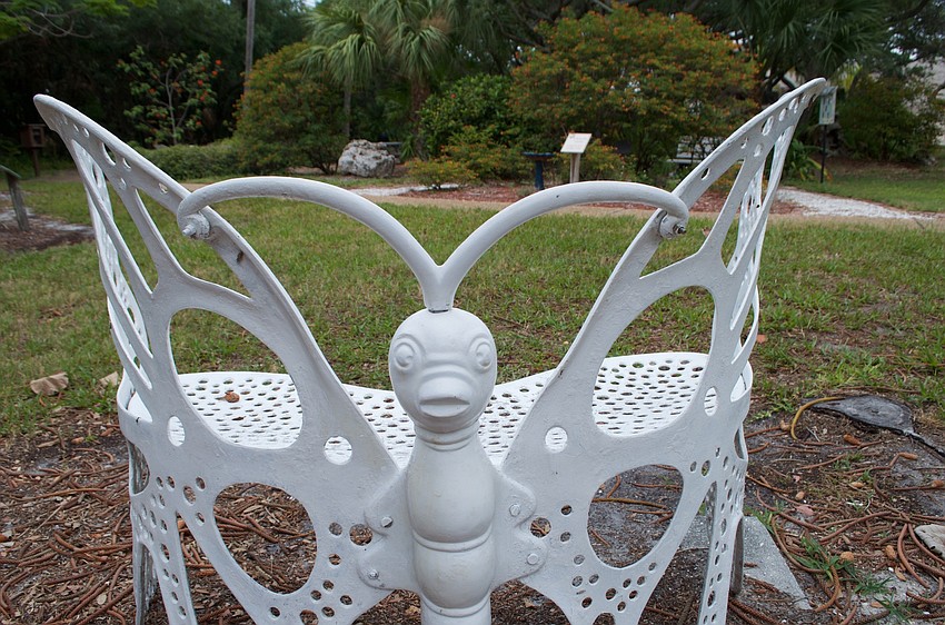 In the butterfly garden, a bench strikes a familiar pose.