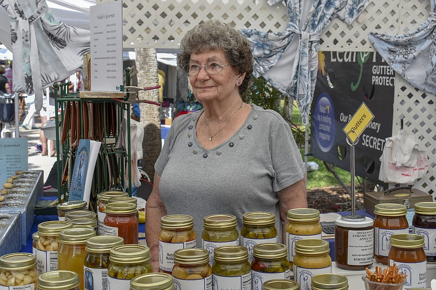 Miriam Valido mans her booth for Valido's Gourmet, which offers different pickled foods, jams and butters.