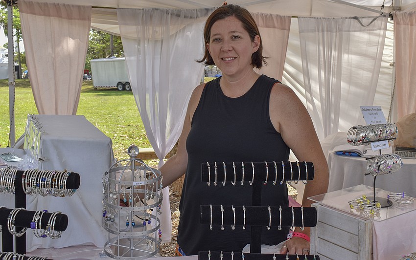 Christy Raml poses with her jewelry from 	Raml Enterprises