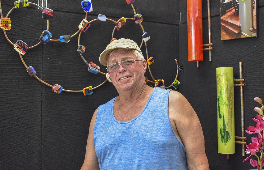 Terry Andrews with his copper and glass sculptures.