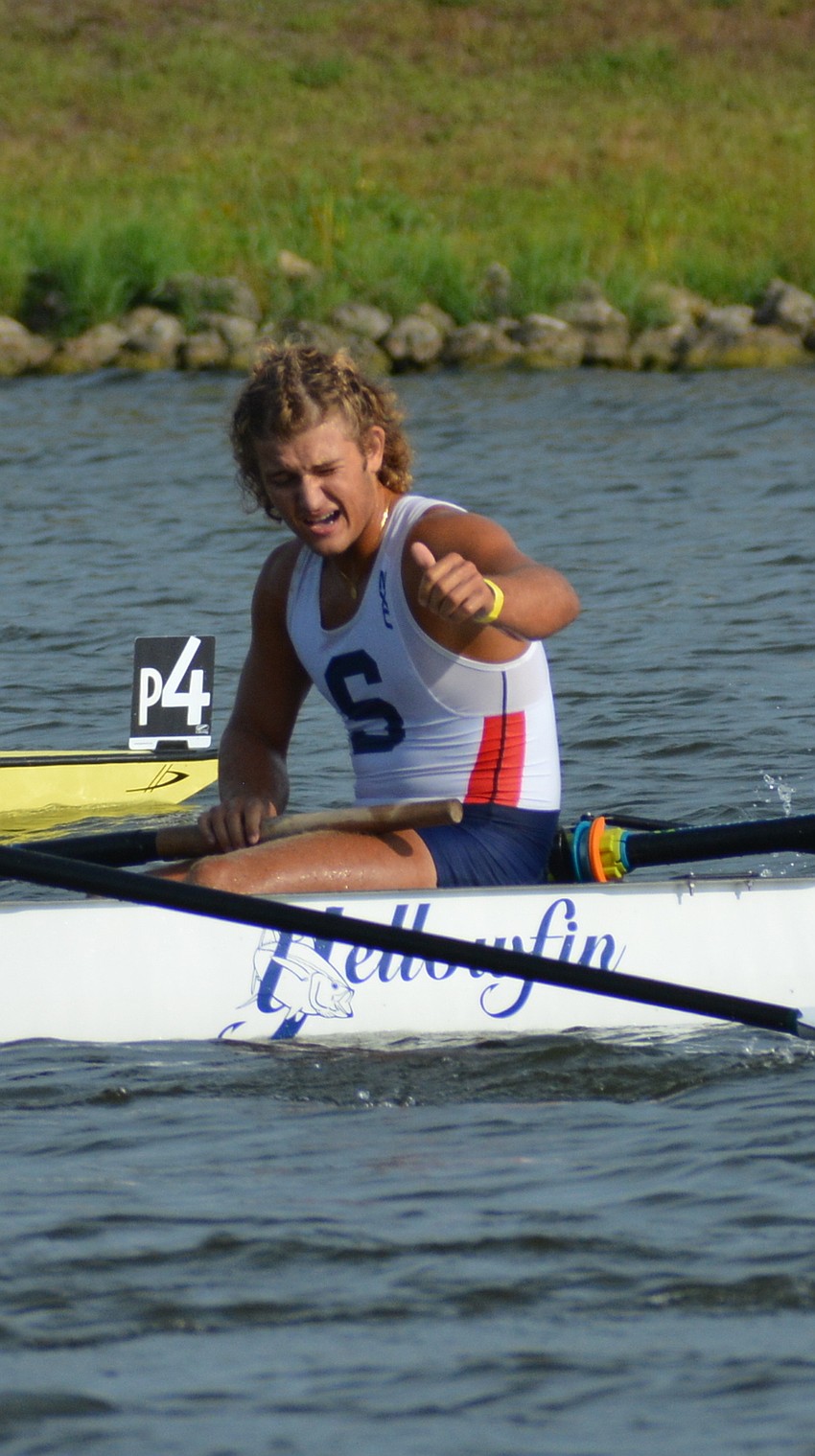 Saraosta Crew's Malakai Leon salutes the crowd after a runner-up finish in the men's 8+ final.