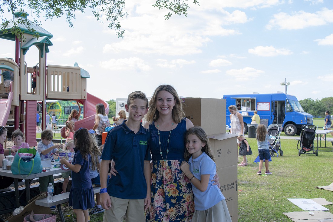Tara Bergstrom Merino with her children Michael and Natalie at The Market, where LWR SAVVY, in partnership with LWR and Little Geniuses, helps facilitate a free tent with activities.