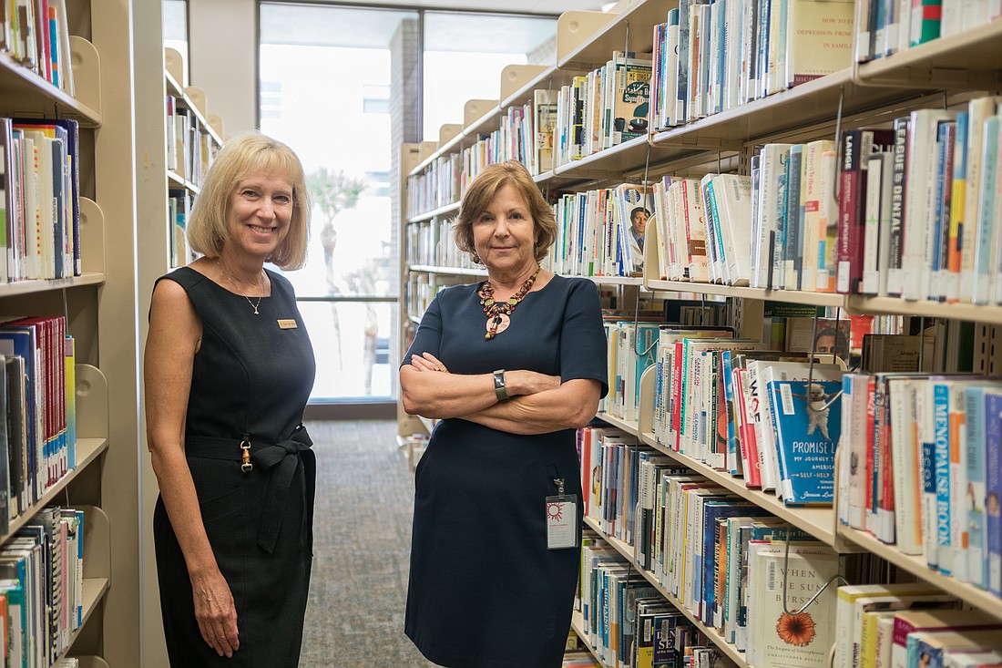 Sue Ann Miller, president of the Friends of the East Manatee Library at Lakewood Ranch and Glenda Lammers, Manatee Countyâ€™s interim library services manager at the Central Library in downtown Bradenton.