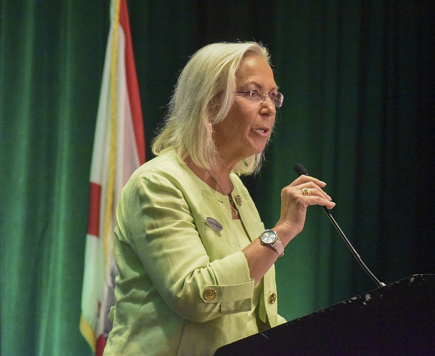 Marcia Dmochowski, general manager of Hyatt Regency Sarasota, gives the award for Nonprofit Organization of the Year.