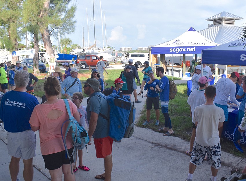 Volunteers and exhibitors gathered Saturday at Sarasota Sailing Squadron.