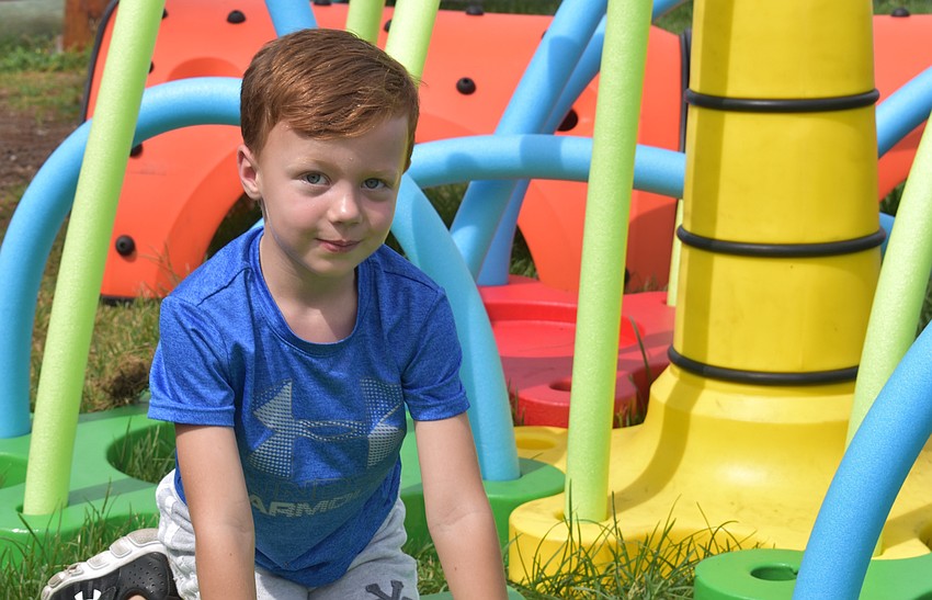 Christian Arnett, 5, enjoyed the play zone with elements made to look like an underwater scene.