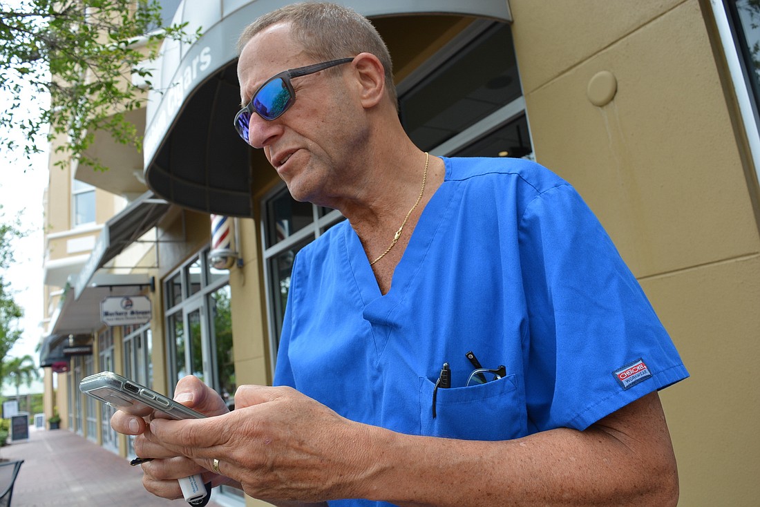 Lakewood Ranch resident Dr. Jay Schwartz has collected thousands of signatures supporting better cell service in Lakewood Ranch. At Main Street, his phone&#39;s signal strength shows only two bars.