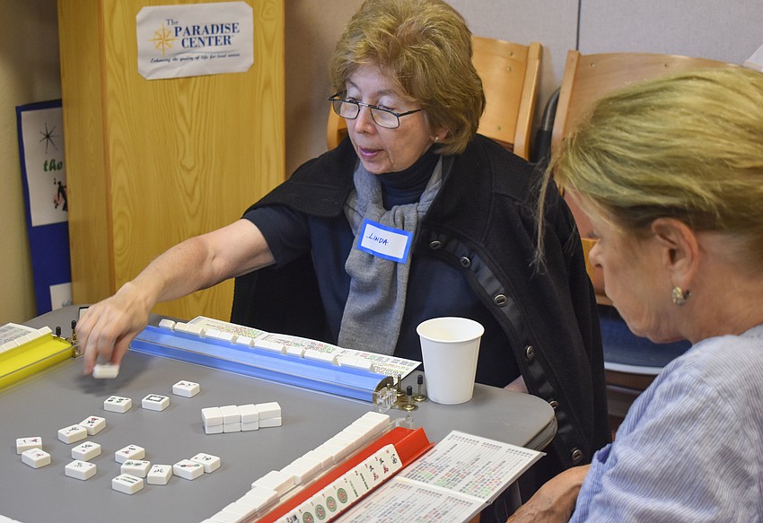 Linda Silber discards one of her tiles.