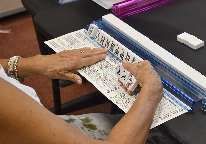 Mahjong is played with 14 tiles per player.