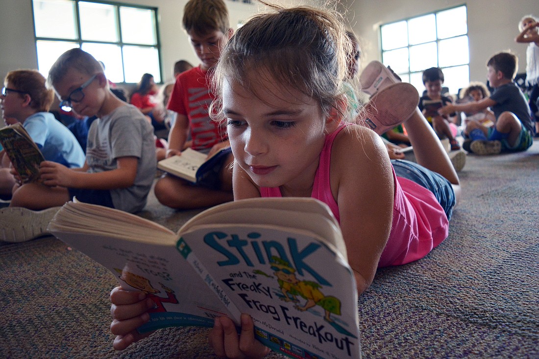 East County&#39;s Riley Makeever, 6, says she likes the Lakewood Ranch YMCA&#39;s daily reading times, which are relaxing.