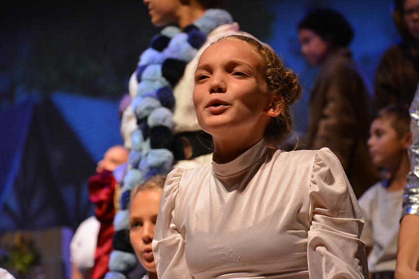 Amber DePasquale is part of the featured Snow Chorus.