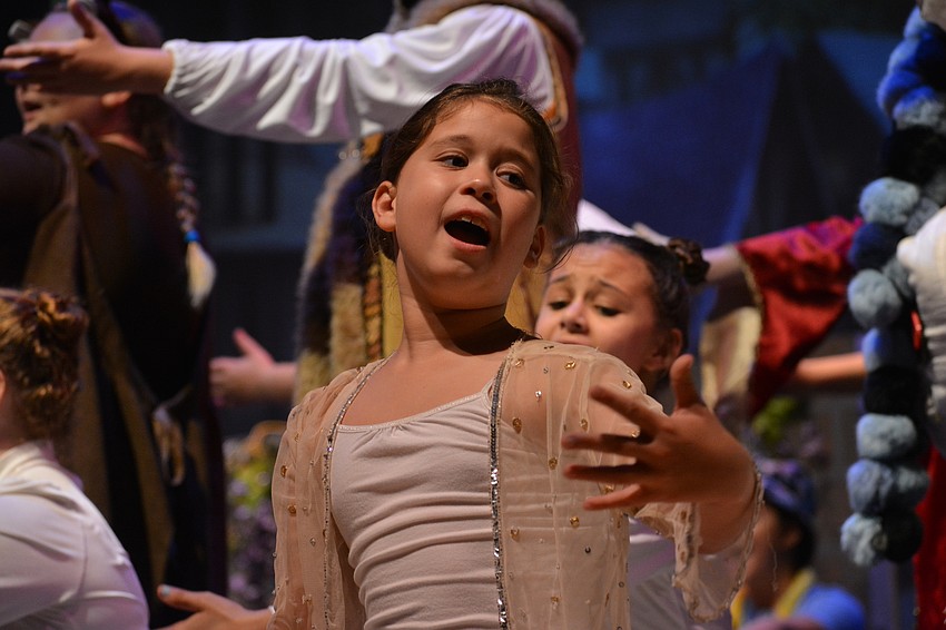 Aslyn McBride sings in the Snow Chorus.