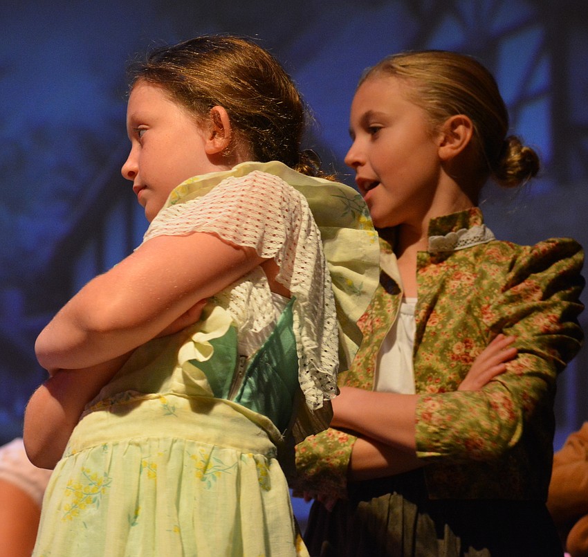 Vike Lewane and Maya Bonora play townspeople in the production.