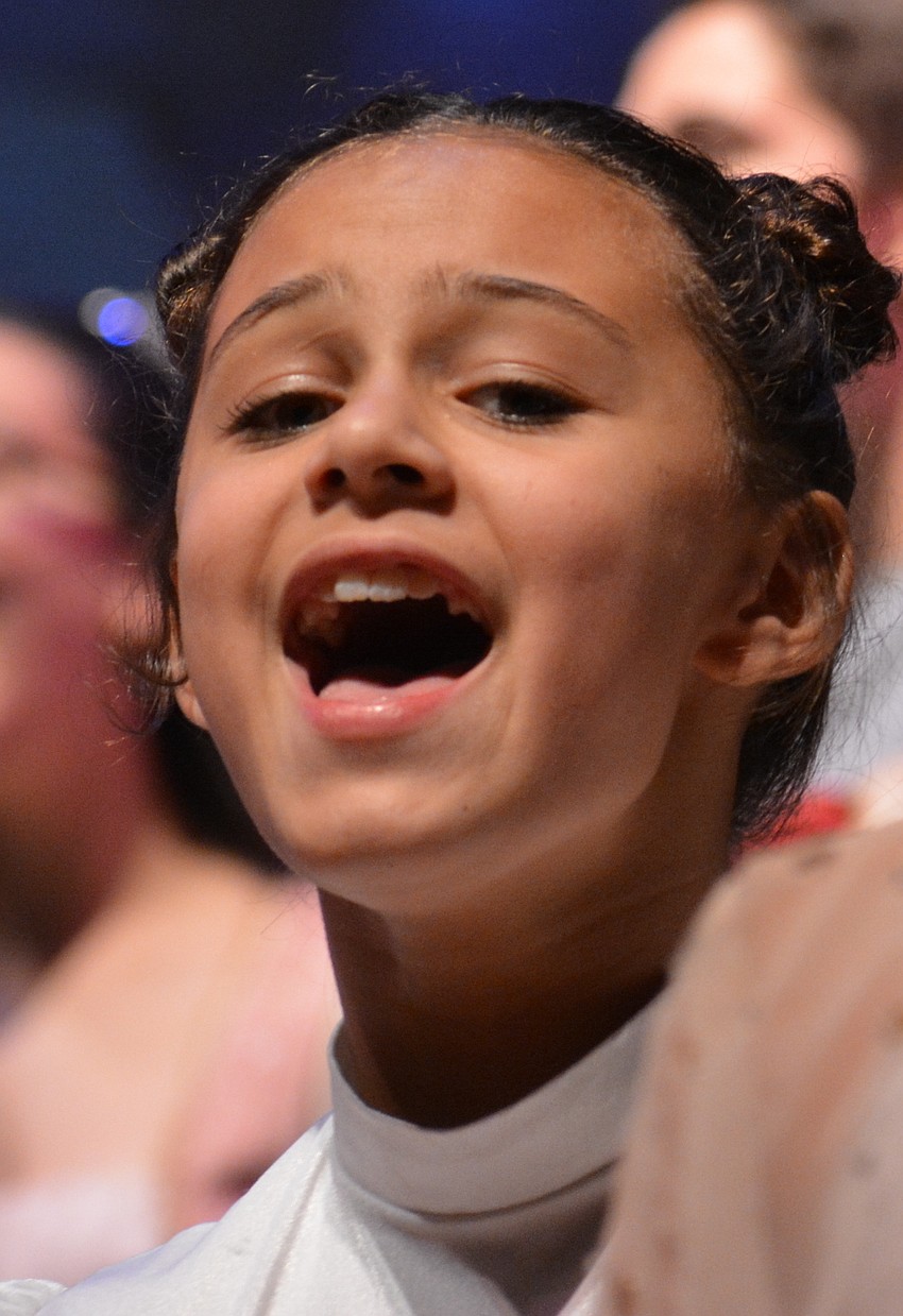 Kynnda Valezquez sings with the Snow Chorus.