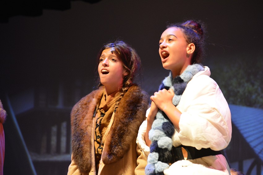 Delaney Martin as Anna and Yaira Spears as Olaf sing during an emotional moment.