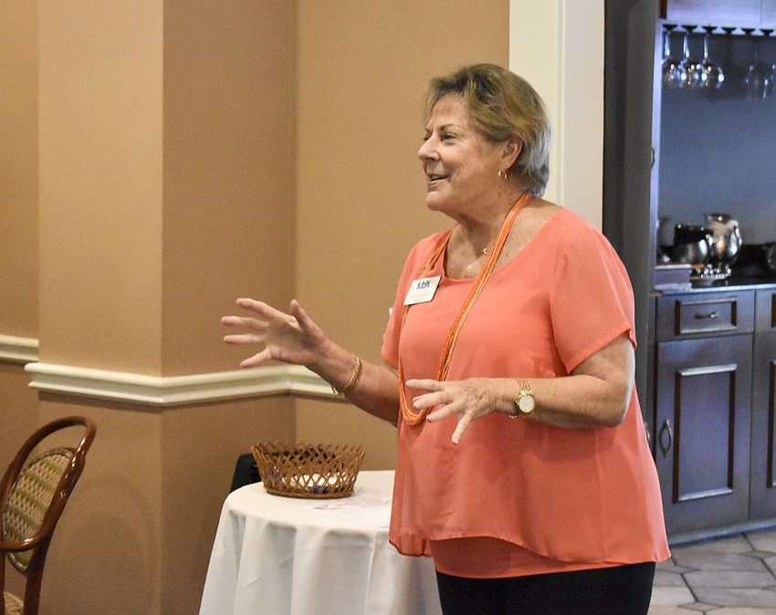 Gail Loefgren, president of the Longboat Key Chamber of Commerce, talks to the members about upcoming chamber events.