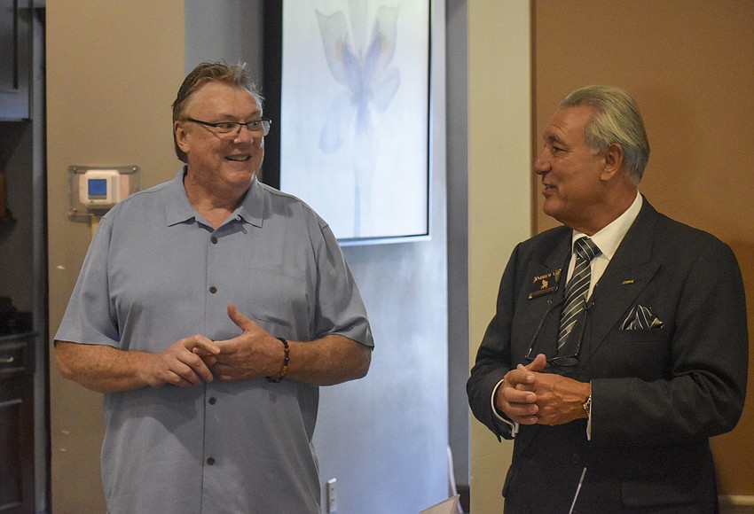 Jean-Pierre Knaggs, owner of The Bijou Cafe, and Andrew Vac welcome the chamber members.